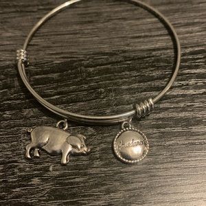 Silver adjustable bracelet with an abundance charm and pig charm